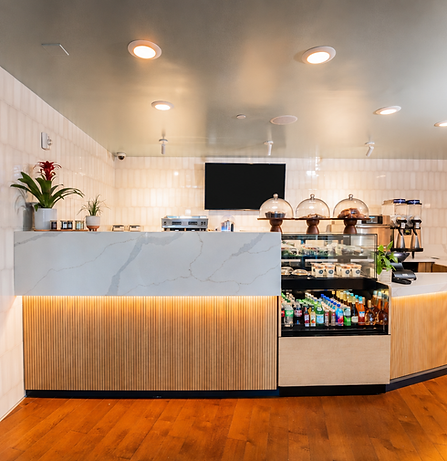 Modern Café Counter with Black Screen.png
